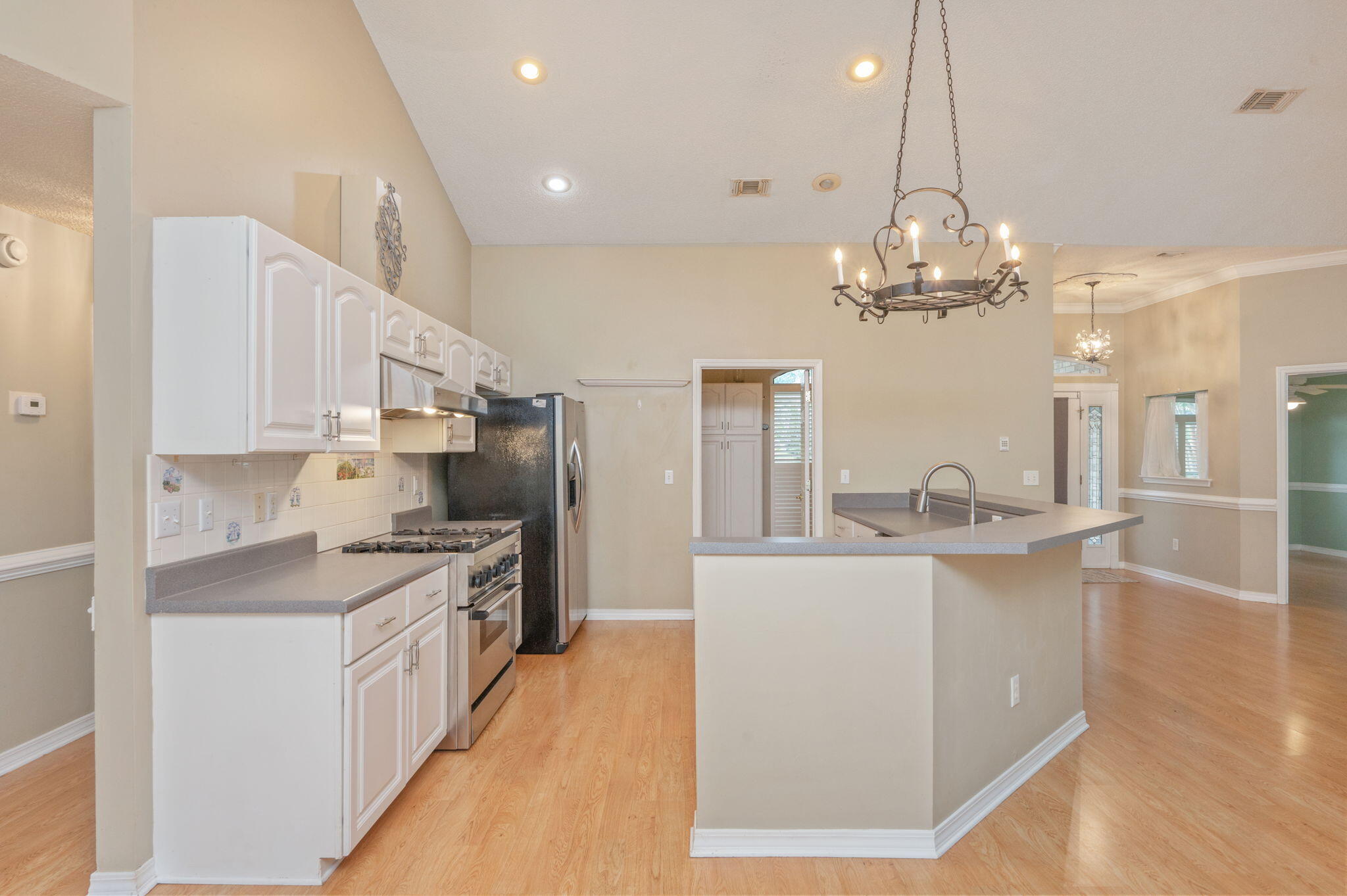 734 Riva Ridge Drive Crestview, FL 32539 - Photo 14 of 53 a large kitchen with kitchen island a sink counter top space and stainless steel appliances