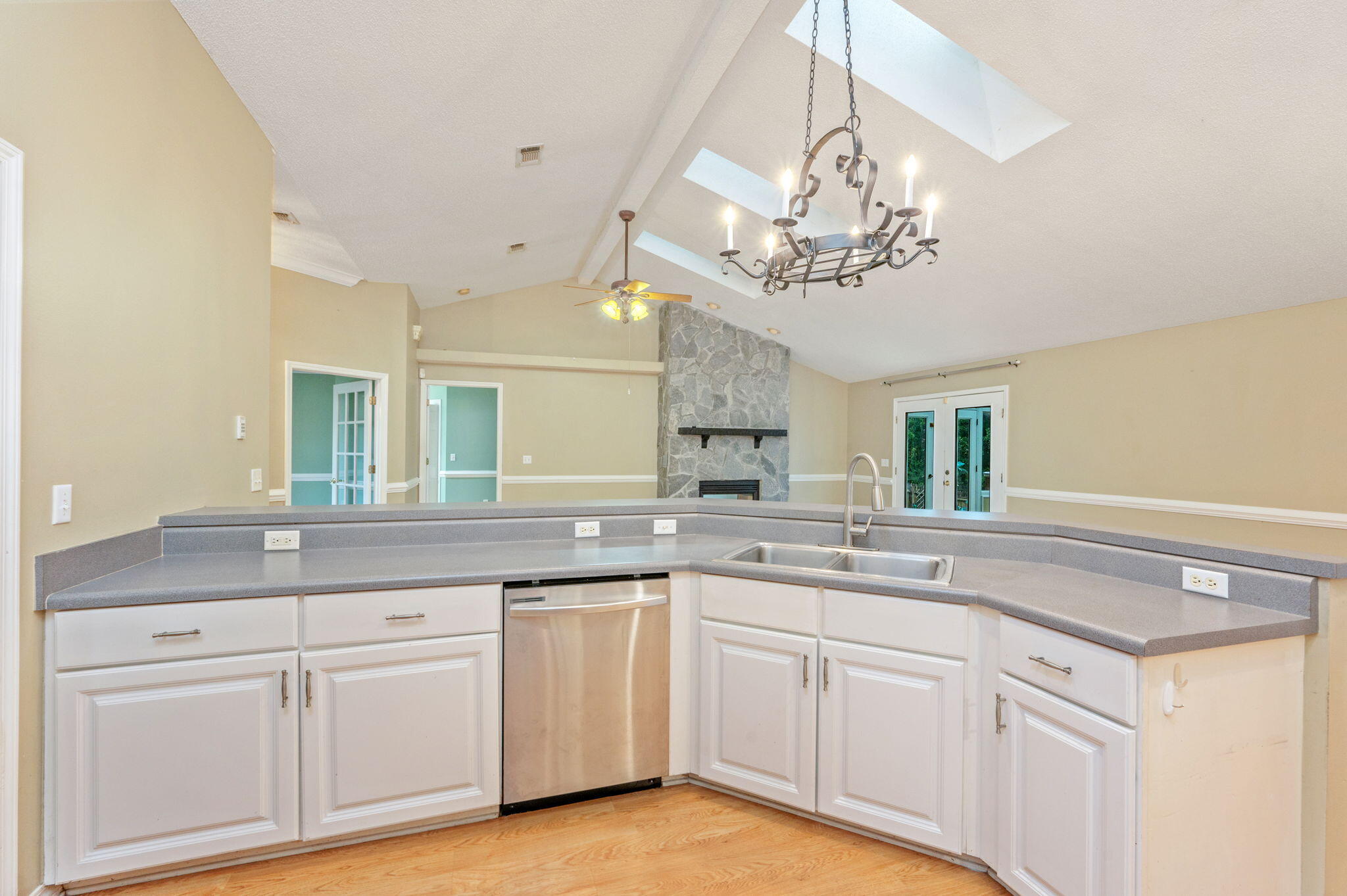734 Riva Ridge Drive Crestview, FL 32539 - Photo 15 of 53 a kitchen with a white cabinets and chandelier