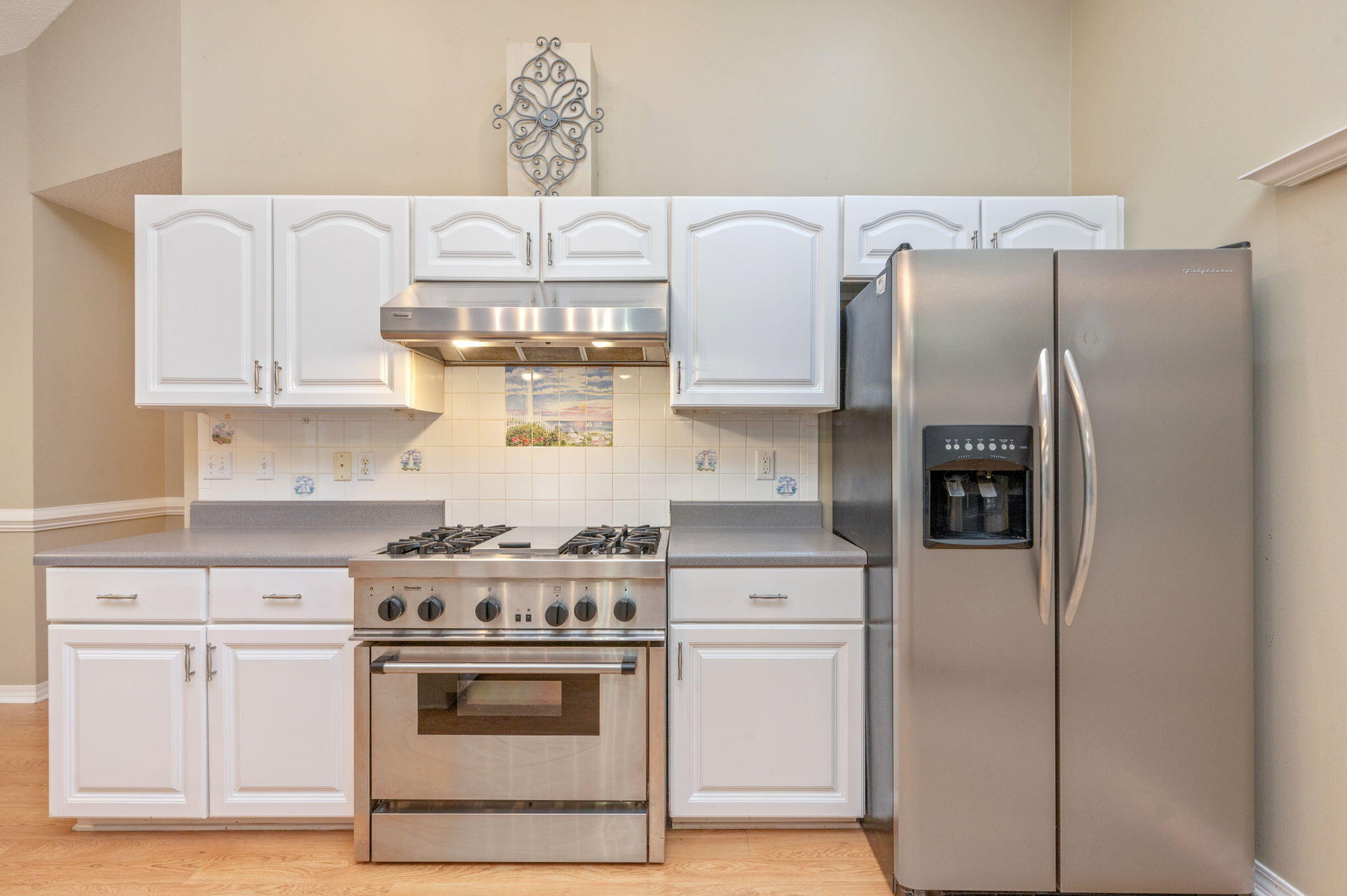 734 Riva Ridge Drive Crestview, FL 32539 - Photo 16 of 53 a kitchen with granite countertop white cabinets and stainless steel appliances