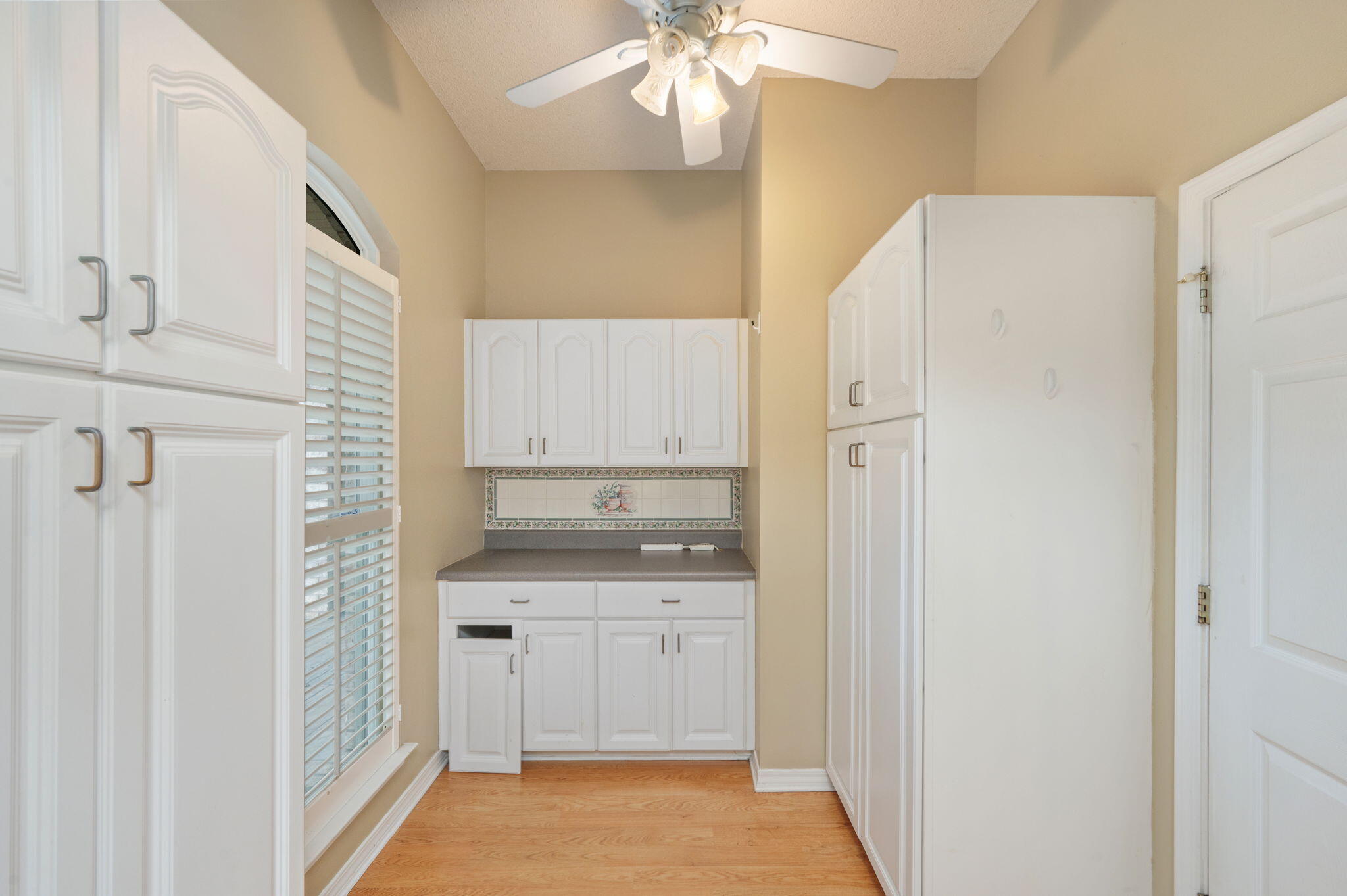 734 Riva Ridge Drive Crestview, FL 32539 - Photo 18 of 53 a kitchen with white cabinets and white appliances