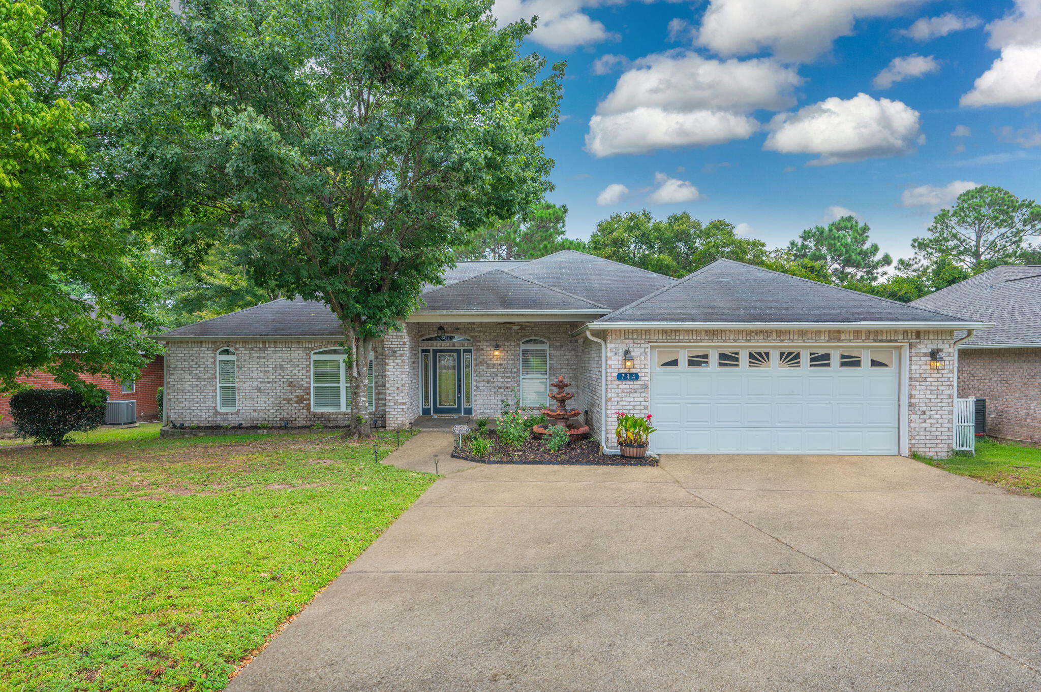 734 Riva Ridge Drive Crestview, FL 32539 - Photo 2 of 53 a view of a house with a yard and garage