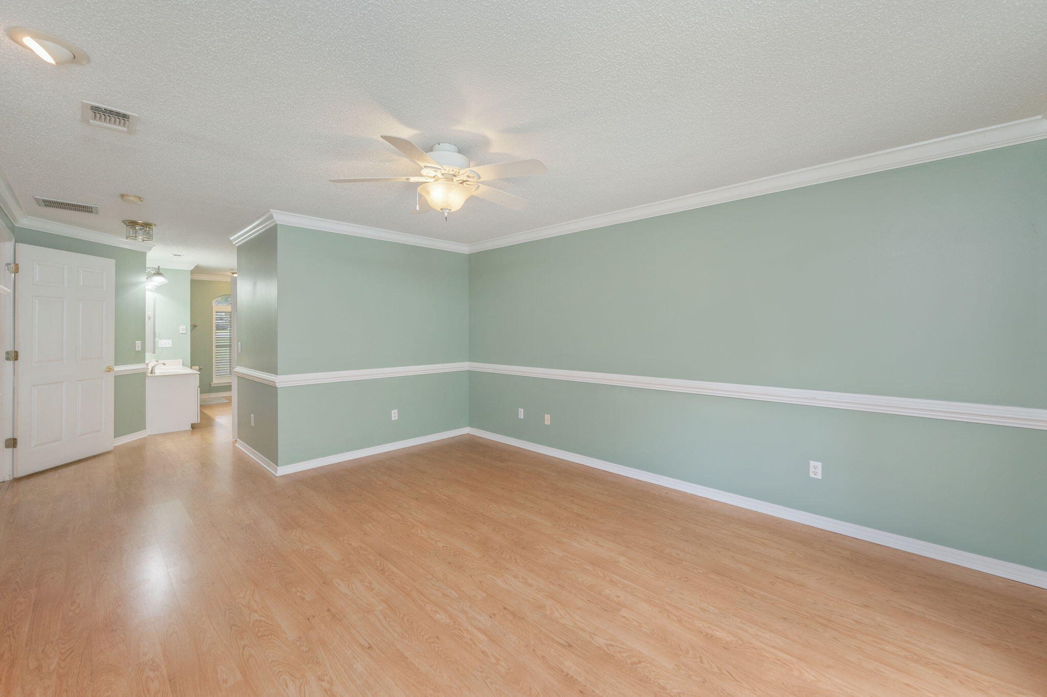 734 Riva Ridge Drive Crestview, FL 32539 - Photo 22 of 53 a view of an empty room with wooden floor
