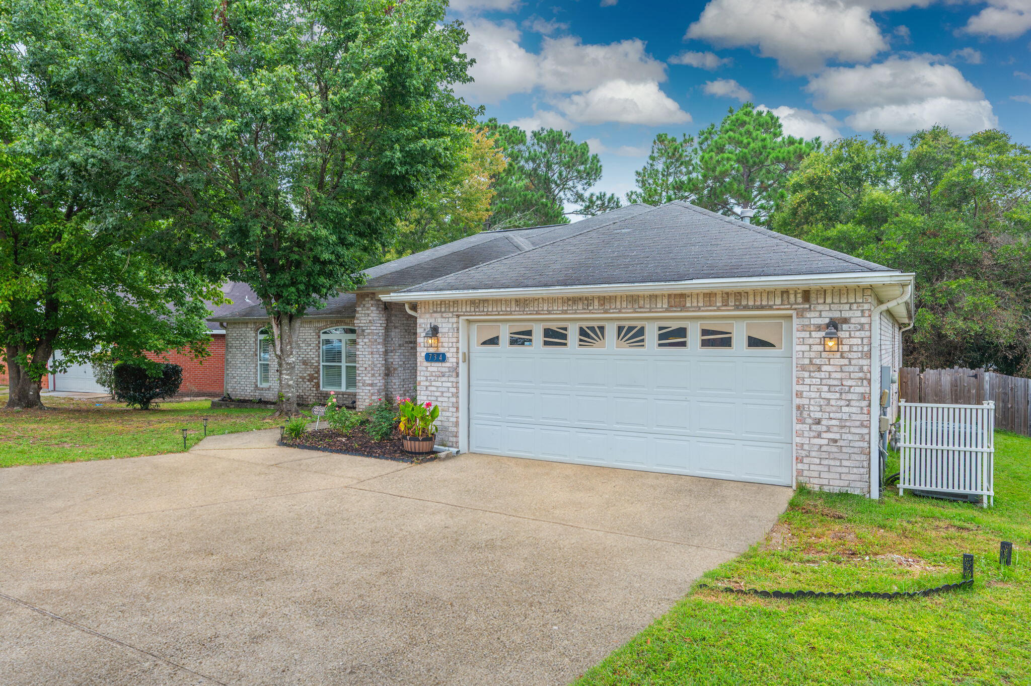 734 Riva Ridge Drive Crestview, FL 32539 - Photo 3 of 53 a view of a house with a yard and garage