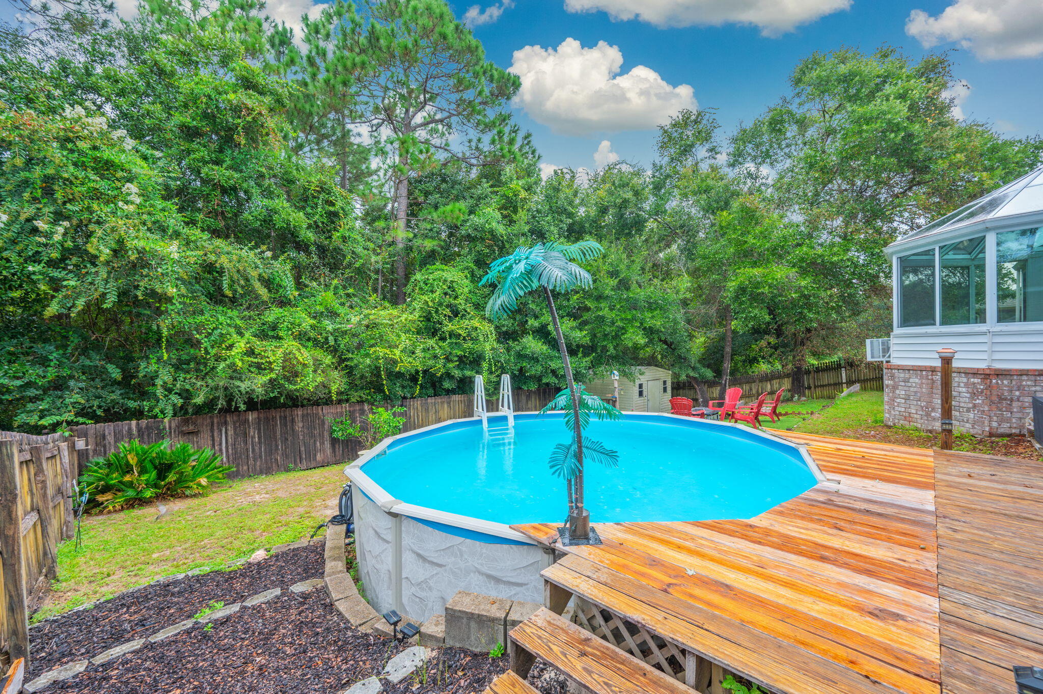 734 Riva Ridge Drive Crestview, FL 32539 - Photo 42 of 53 a view of a swimming pool with a patio and a yard