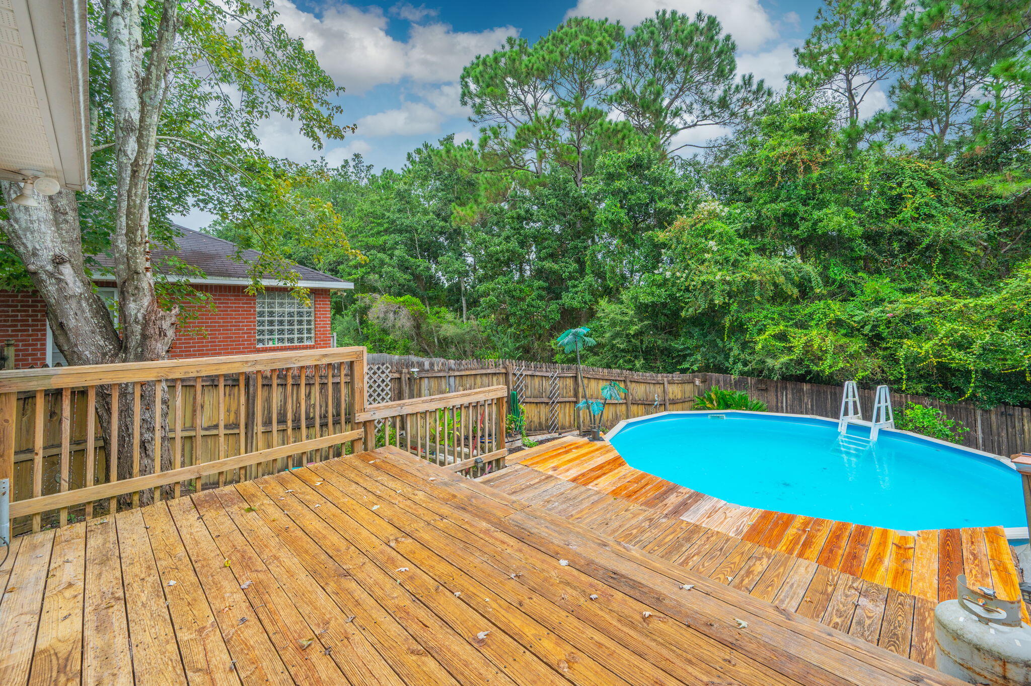 734 Riva Ridge Drive Crestview, FL 32539 - Photo 44 of 53 a view of a swimming pool with a patio and yard