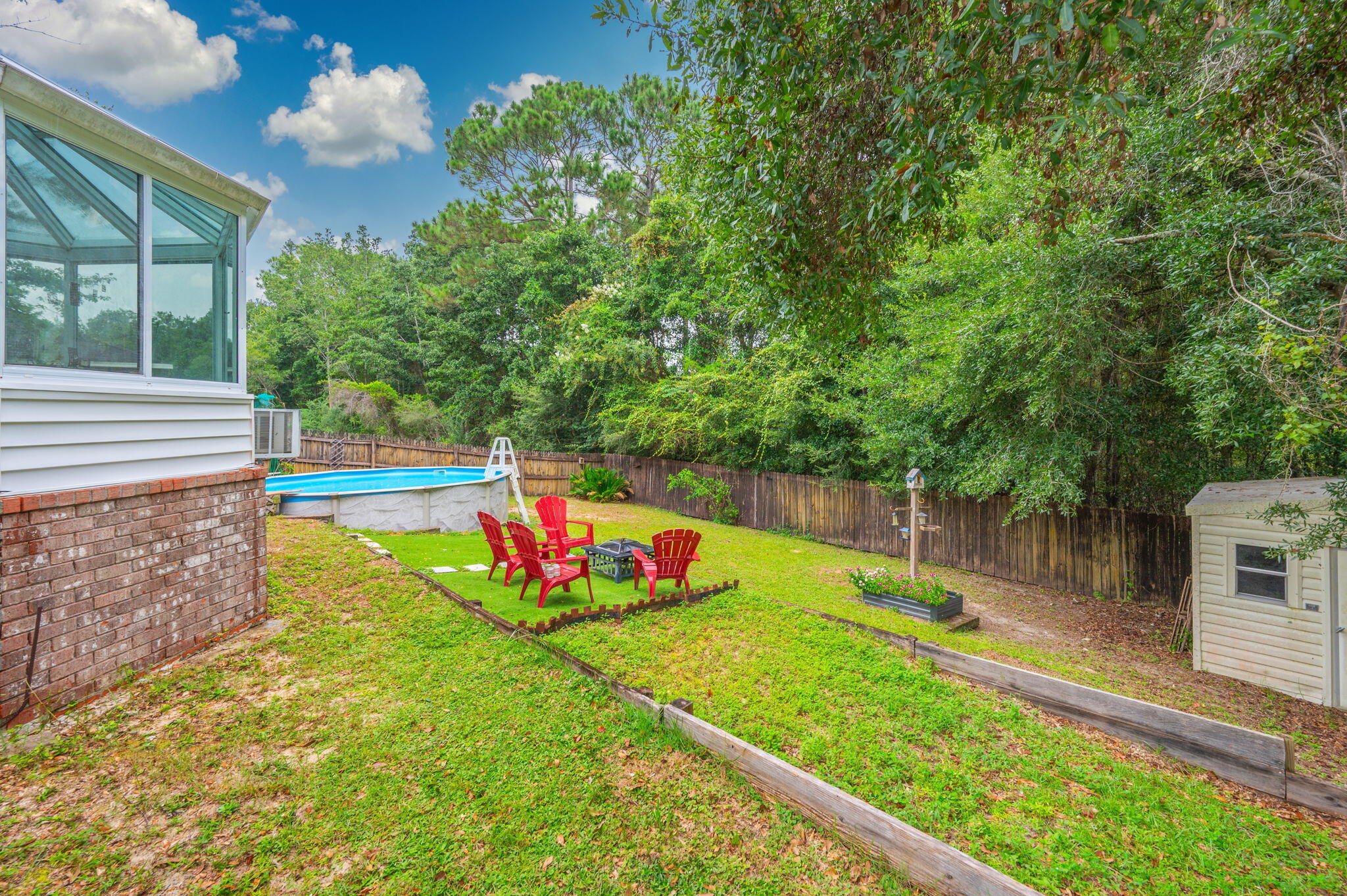 734 Riva Ridge Drive Crestview, FL 32539 - Photo 51 of 53 a view of a garden with an outdoor space