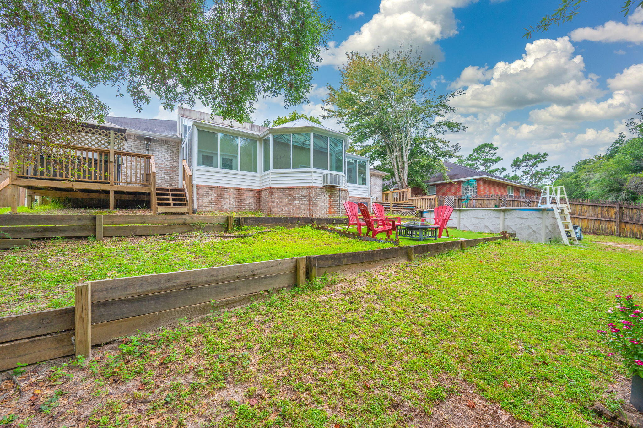 734 Riva Ridge Drive Crestview, FL 32539 - Photo 52 of 53 a view of a house with swimming pool and a yard
