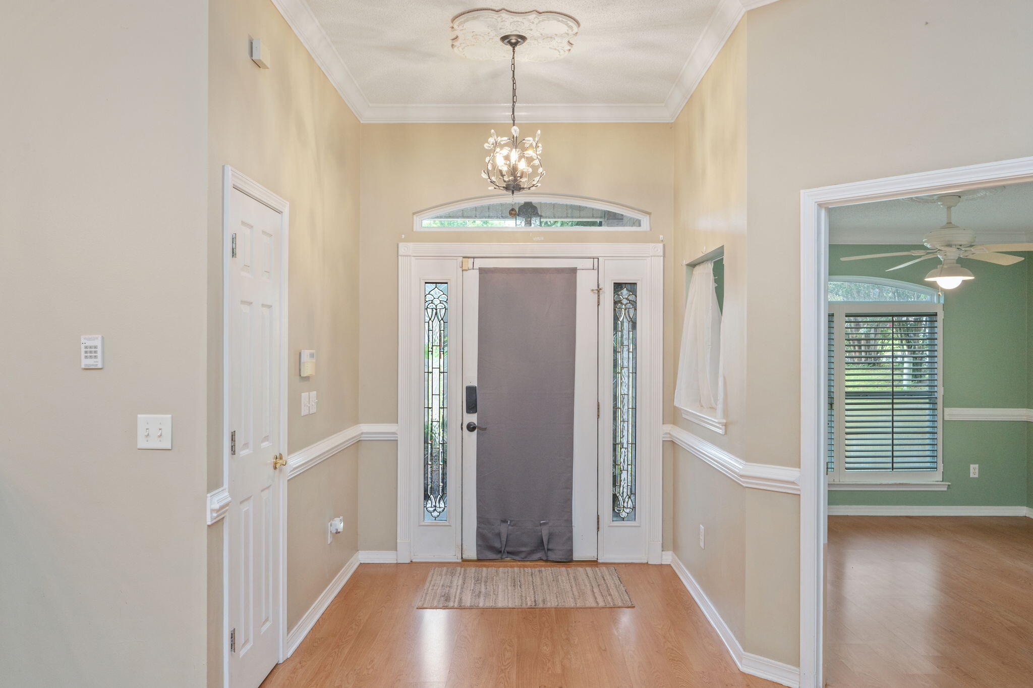 734 Riva Ridge Drive Crestview, FL 32539 - Photo 6 of 53 wooden floor in an empty room with a window