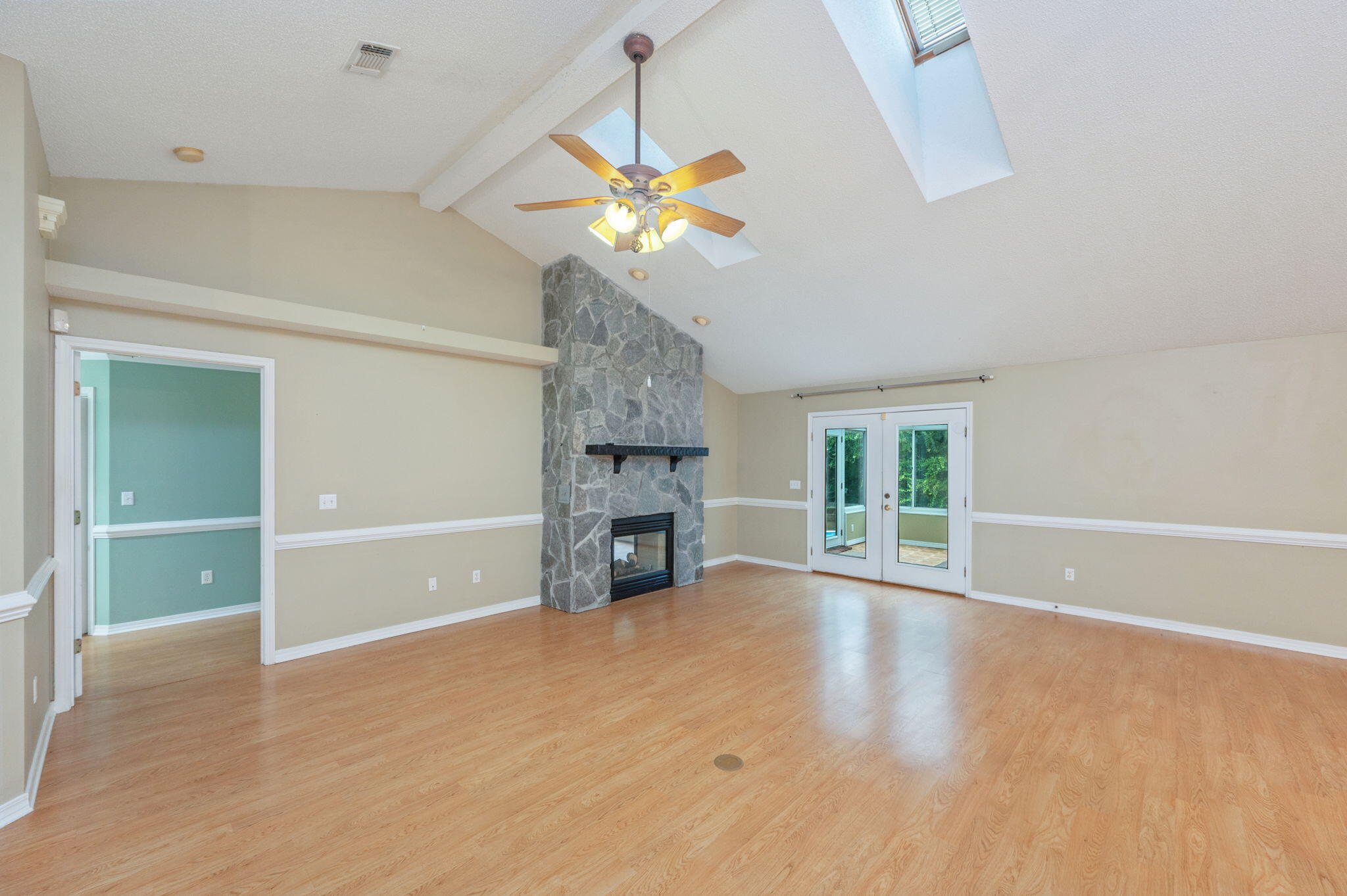 734 Riva Ridge Drive Crestview, FL 32539 - Photo 7 of 53 wooden floor in an empty room with a window