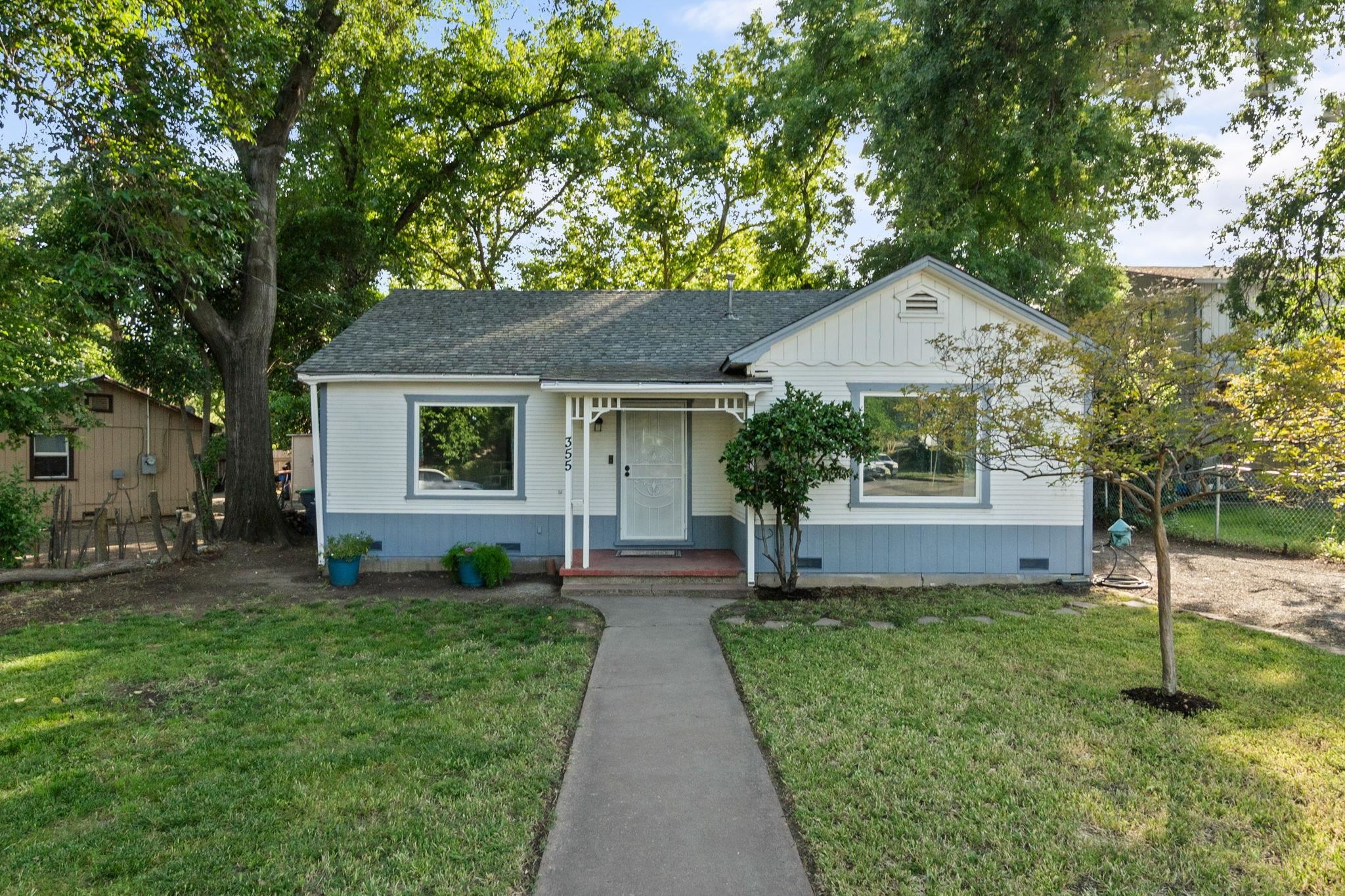 355 Jackson Street Red Bluff, CA 96080 - Photo 1 of 24 a front view of a house with garden