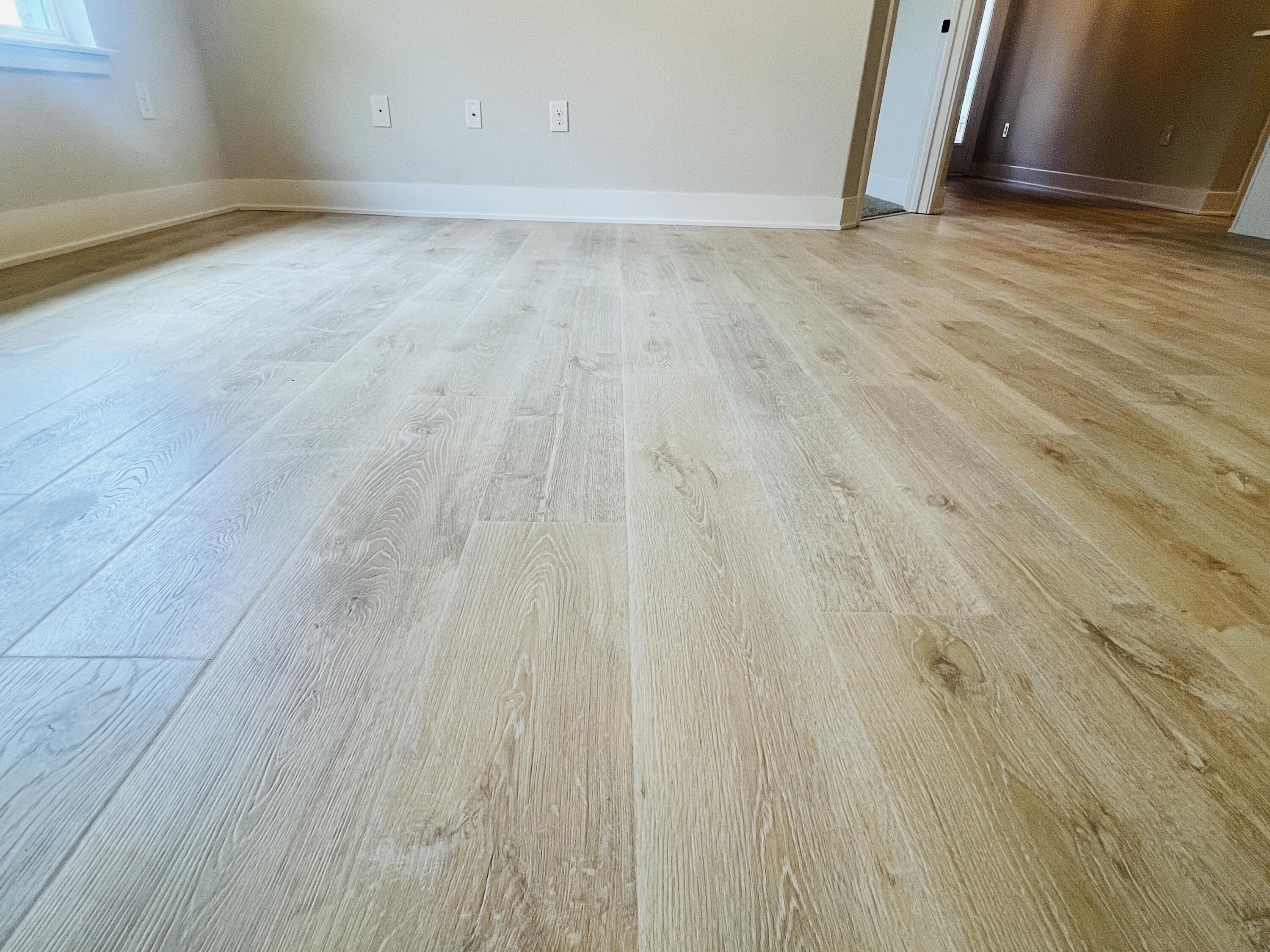 5295 Hidden Pines Circle Milton, FL 32583 - Photo 15 of 16 a view of an empty room with wooden floor