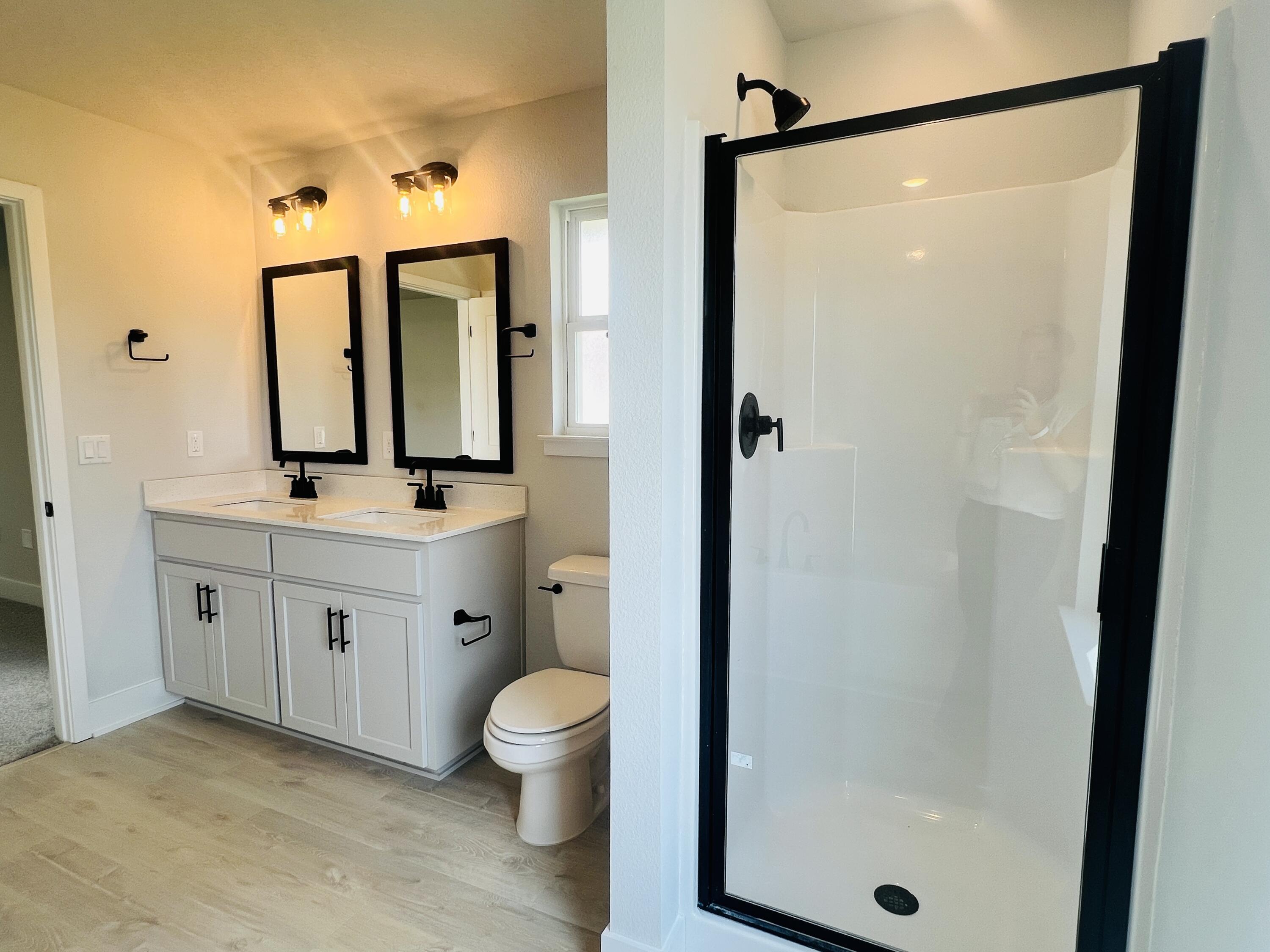 5295 Hidden Pines Circle Milton, FL 32583 - Photo 5 of 16 a bathroom with a toilet a sink and a mirror