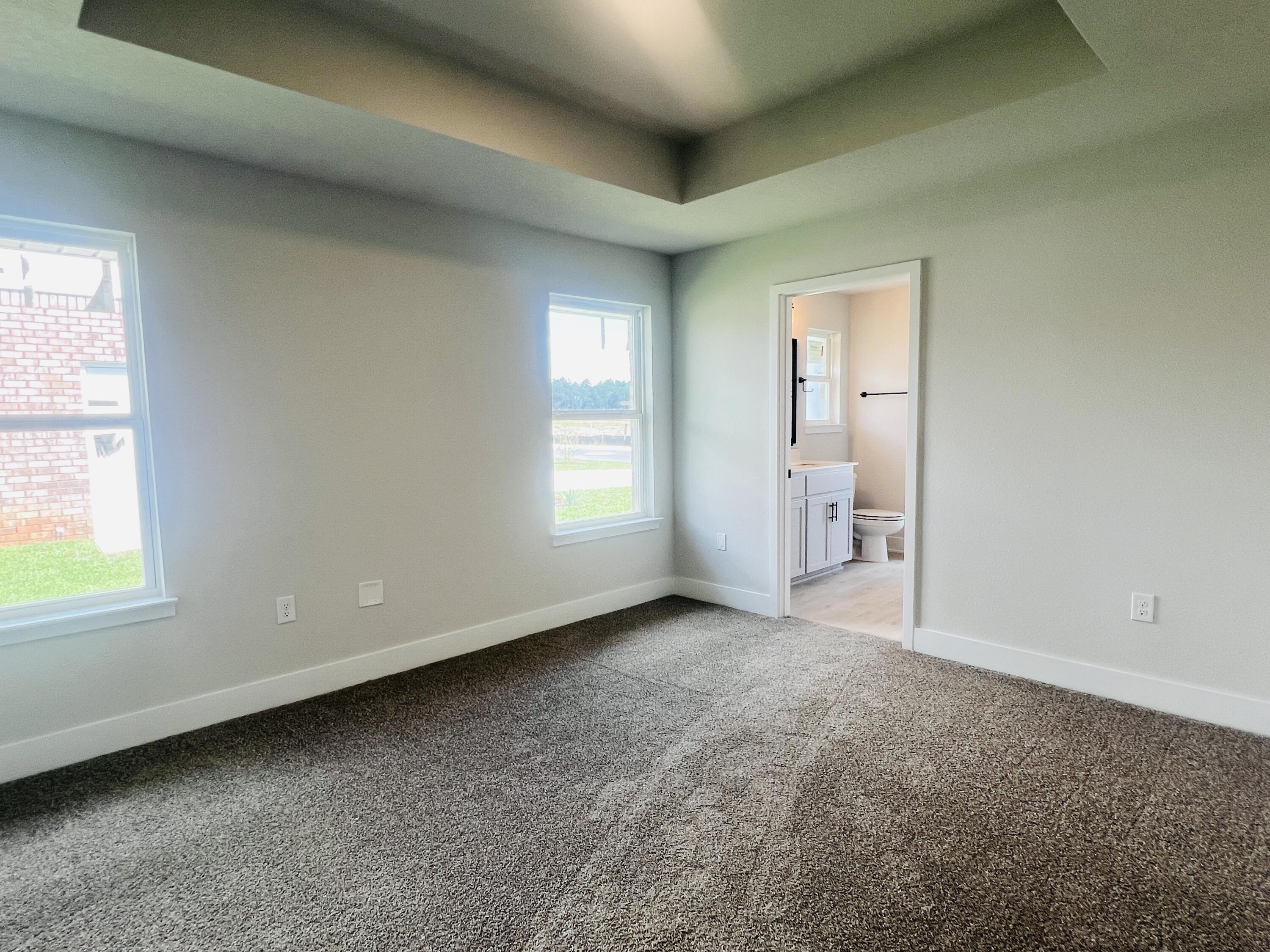 5295 Hidden Pines Circle Milton, FL 32583 - Photo 9 of 16 an empty room with windows