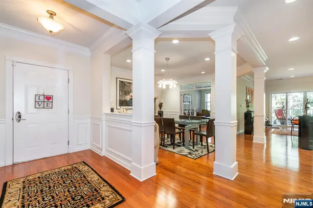 a view of a dining area with furniture and wooden floor