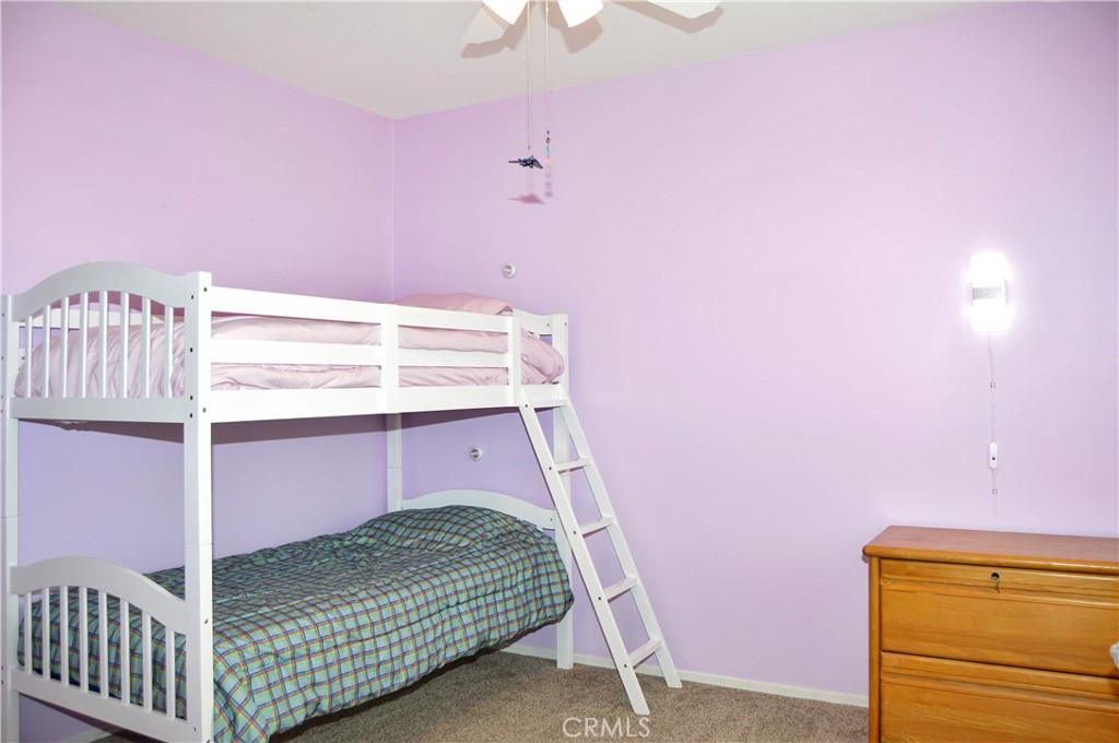 166 Fox Lane Calimesa, CA 92320 - Photo 45 of 76 2nd Bedroom with Ceiling Fan, Walk-in Closet, and Cozy Carpet