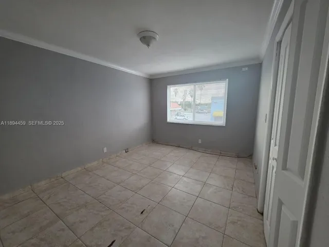 a view of an empty room and window