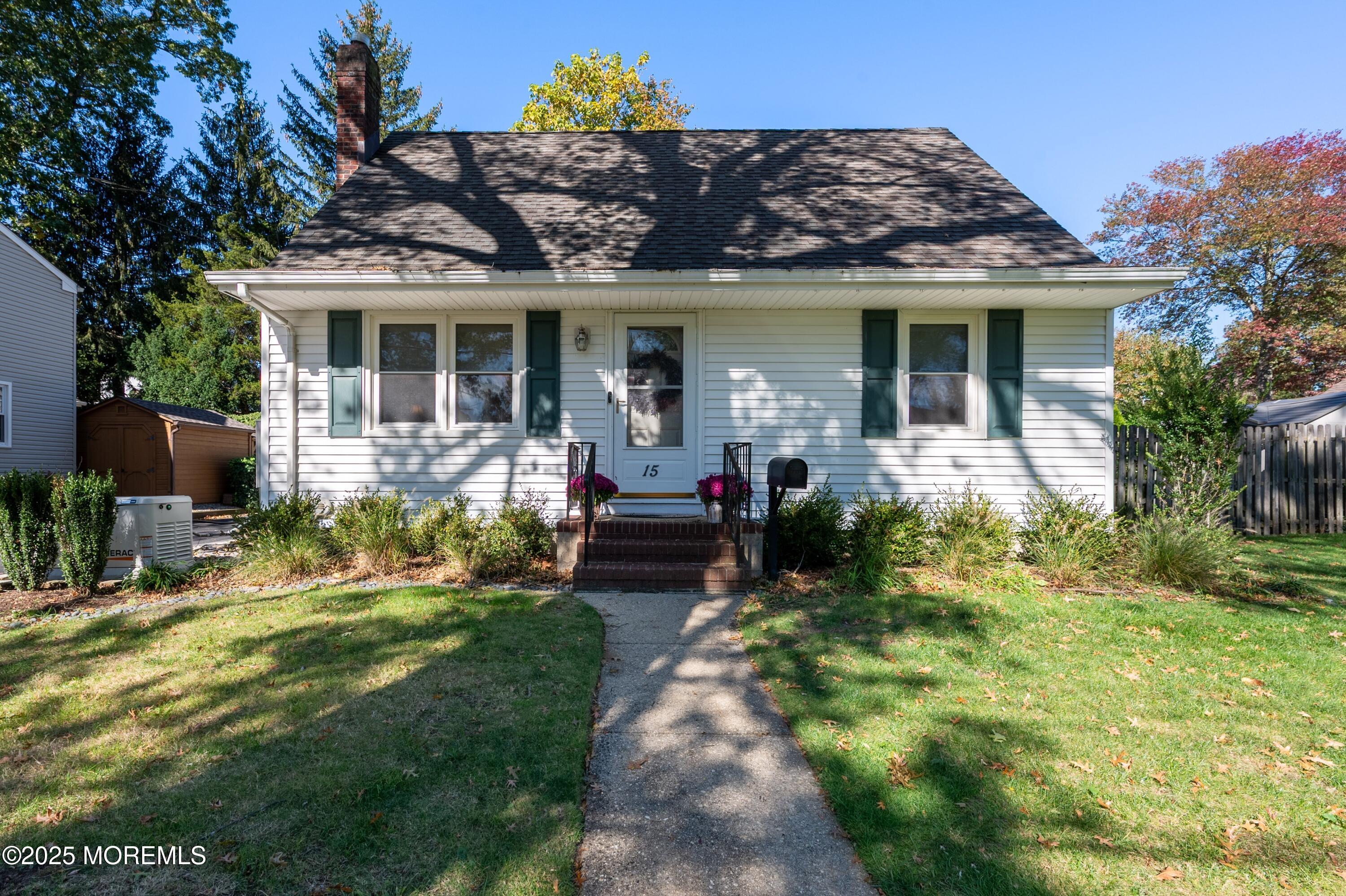 15 Hillside Street Red Bank, NJ 07701 - Photo 1 of 39 a front view of a house with a garden and porch