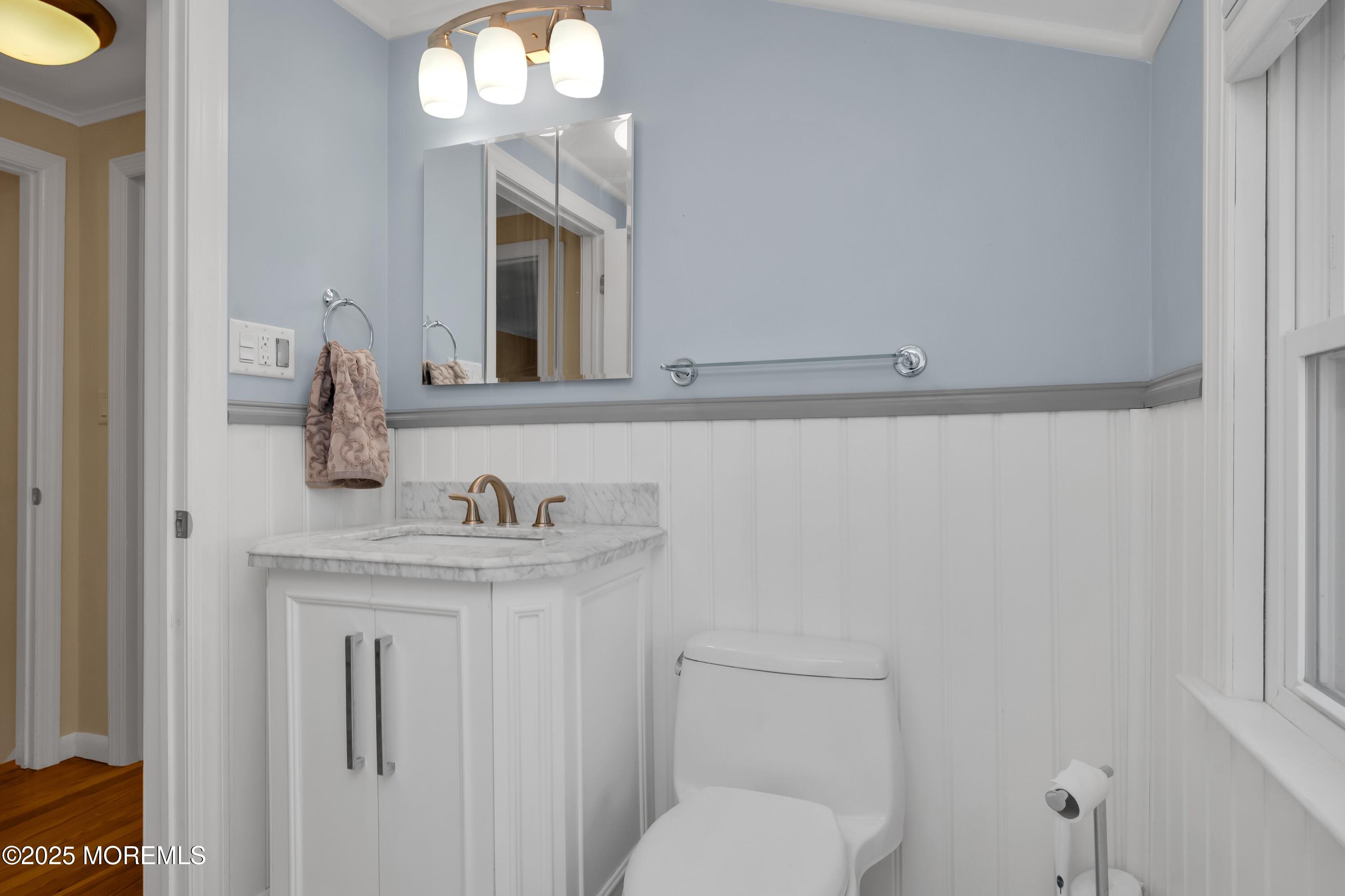15 Hillside Street Red Bank, NJ 07701 - Photo 17 of 39 a bathroom with a granite countertop toilet sink and mirror