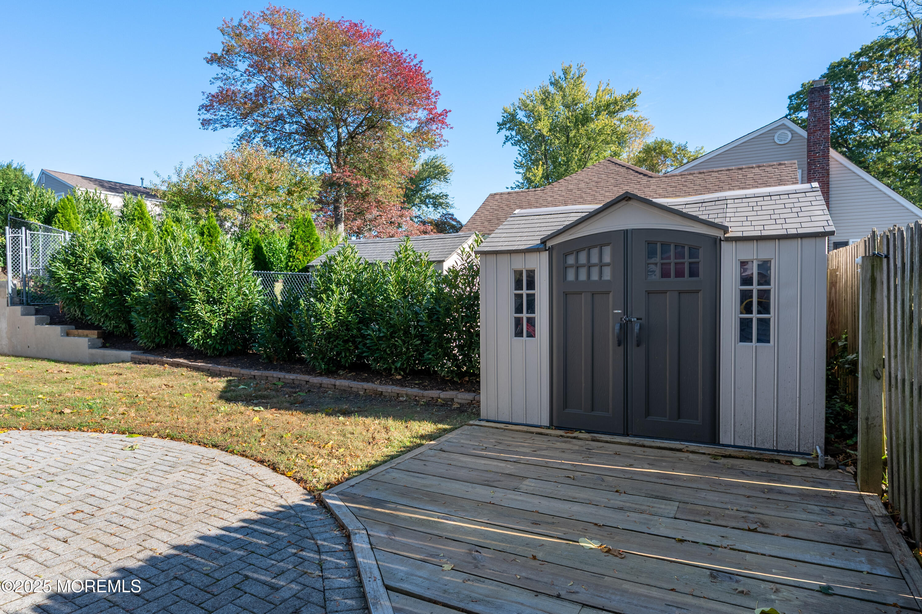 15 Hillside Street Red Bank, NJ 07701 - Photo 32 of 39 a view of a house with pool and wooden fence