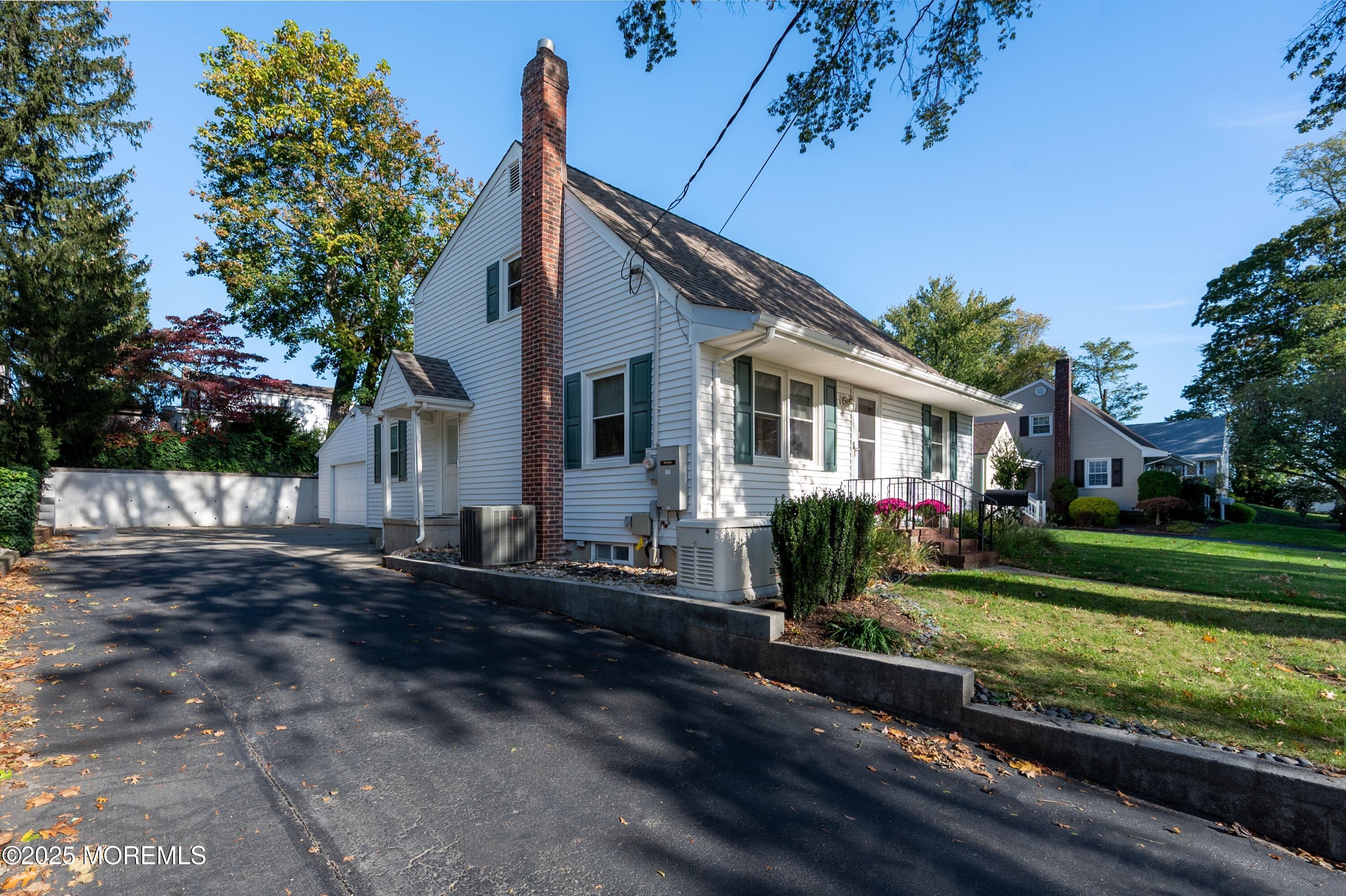 15 Hillside Street Red Bank, NJ 07701 - Photo 35 of 39 a front view of a house with a yard