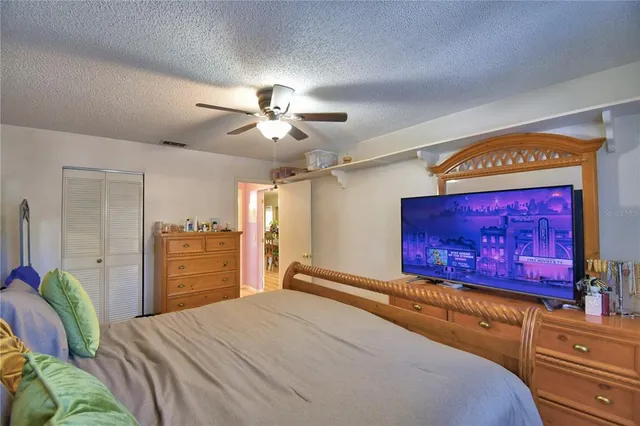 a bathroom with a sink vanity tub and toilet