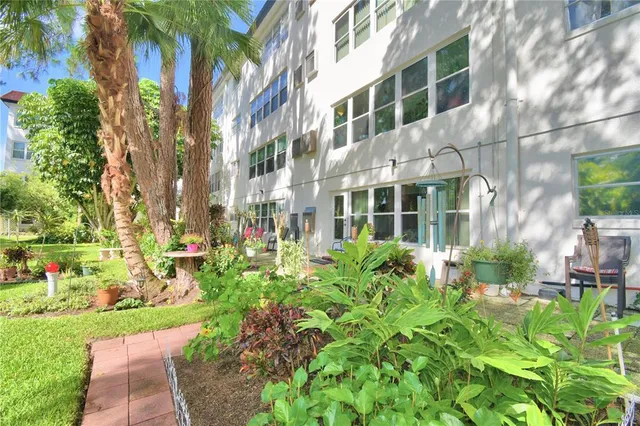 a view of a building with a yard