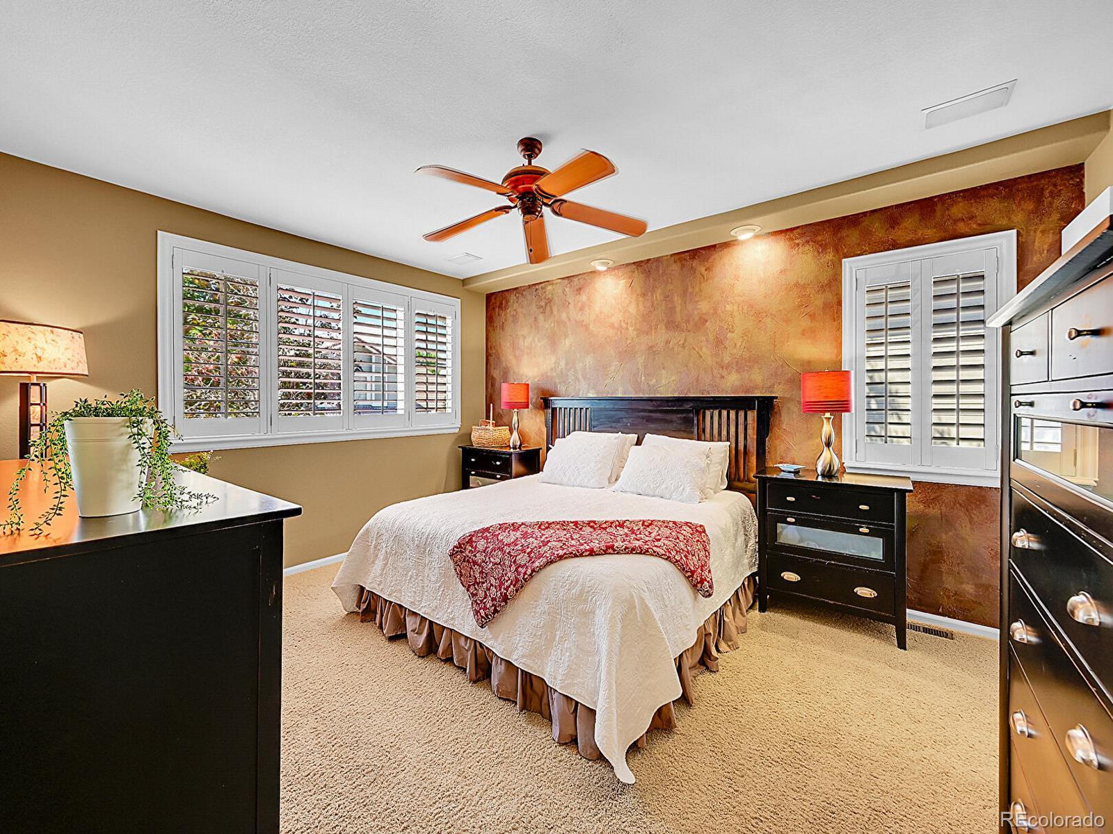 1221 Braewood Avenue Highlands Ranch, CO 80129 - Photo 16 of 45 a bedroom with a bed and window