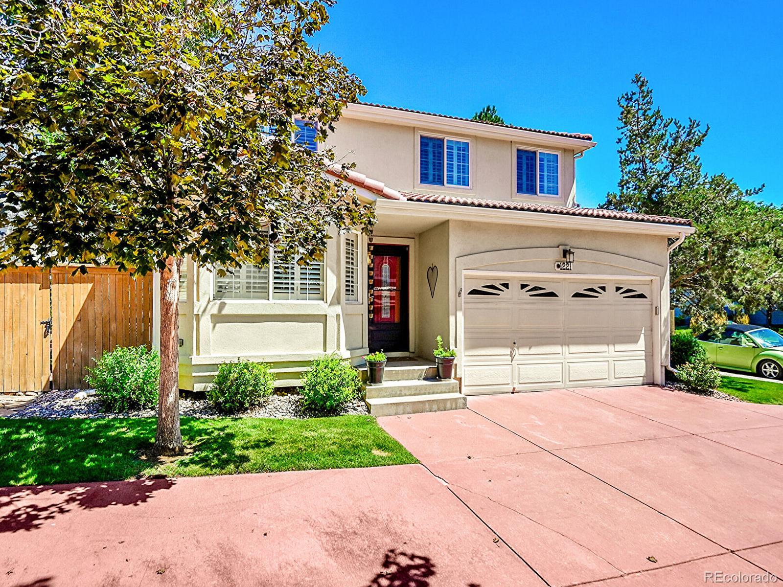 1221 Braewood Avenue Highlands Ranch, CO 80129 - Photo 2 of 45 a front view of a house with garden