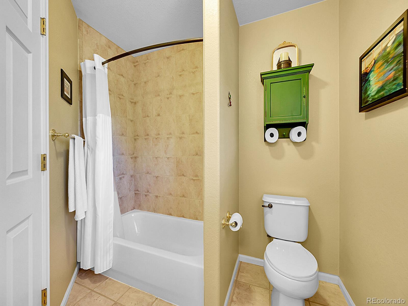 1221 Braewood Avenue Highlands Ranch, CO 80129 - Photo 23 of 45 a bathroom with a toilet and a shower