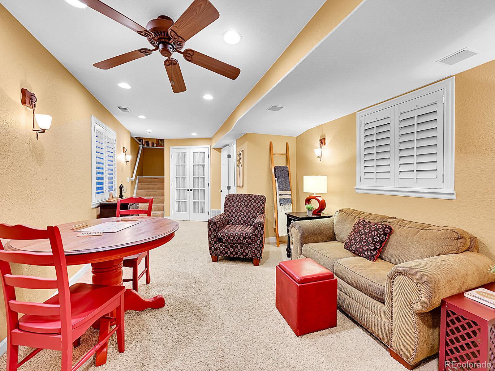 1221 Braewood Avenue Highlands Ranch, CO 80129 - Photo 26 of 45 a living room with furniture and a large window