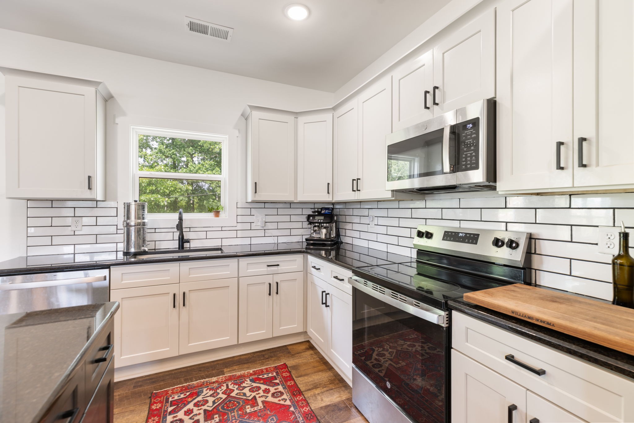 1578 Angus Way Greenbrier, TN 37073 - Photo 19 of 45 a kitchen with stainless steel appliances a sink dishwasher a stove microwave and cabinets