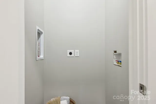 a view of a livingroom with wooden floor and a window