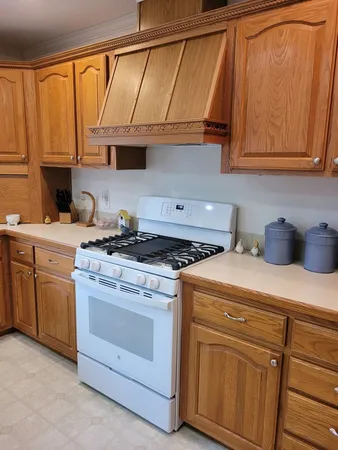 a kitchen with appliances cabinets and a sink