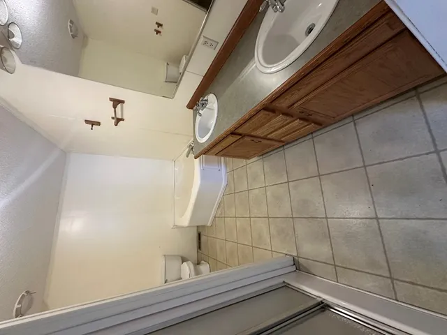 a bathroom with a sink and mirror