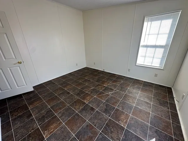 an empty room with a bathroom