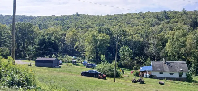 an aerial view of a house with a garden
