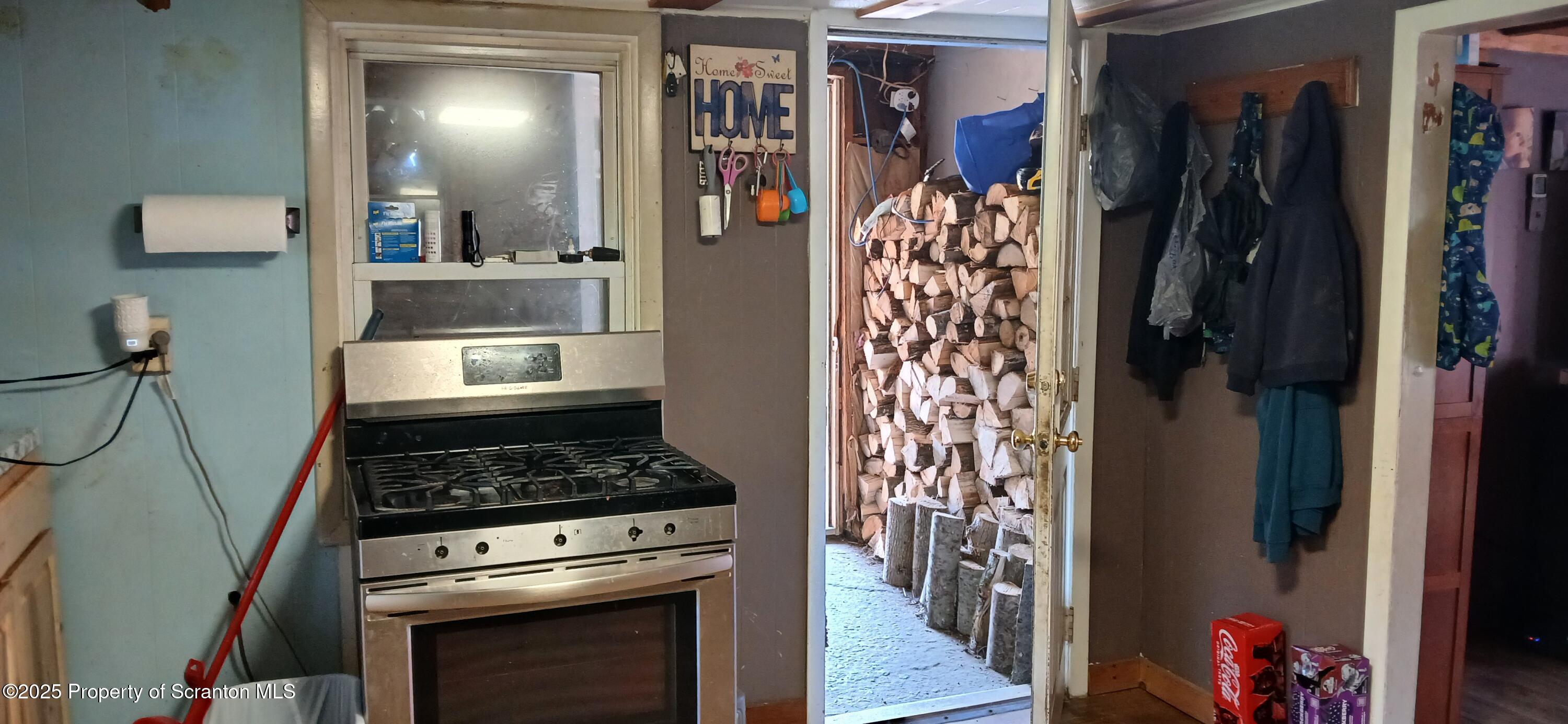 4530 Oak Hill Road Susquehanna, PA 18847 - Photo 13 of 40 a kitchen with a refrigerator and a stove