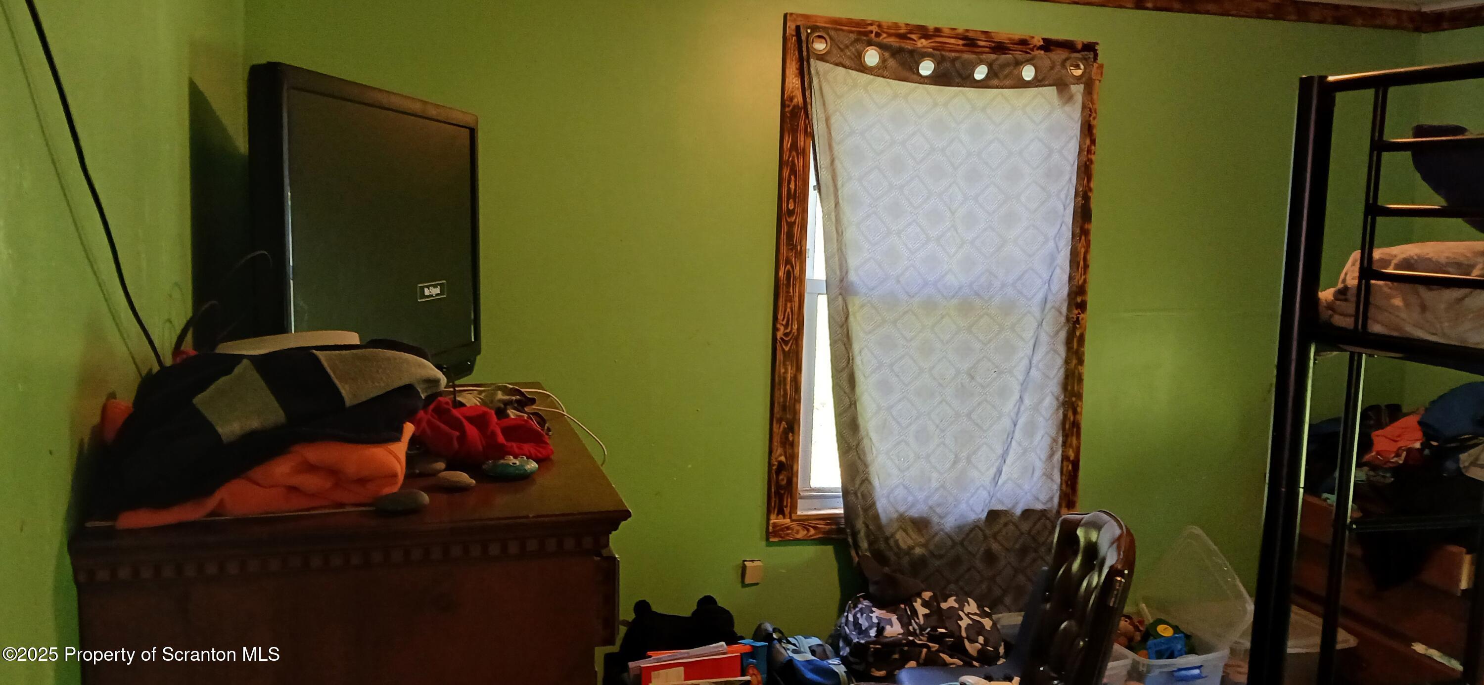 4530 Oak Hill Road Susquehanna, PA 18847 - Photo 22 of 40 a bed room with a bed and a window