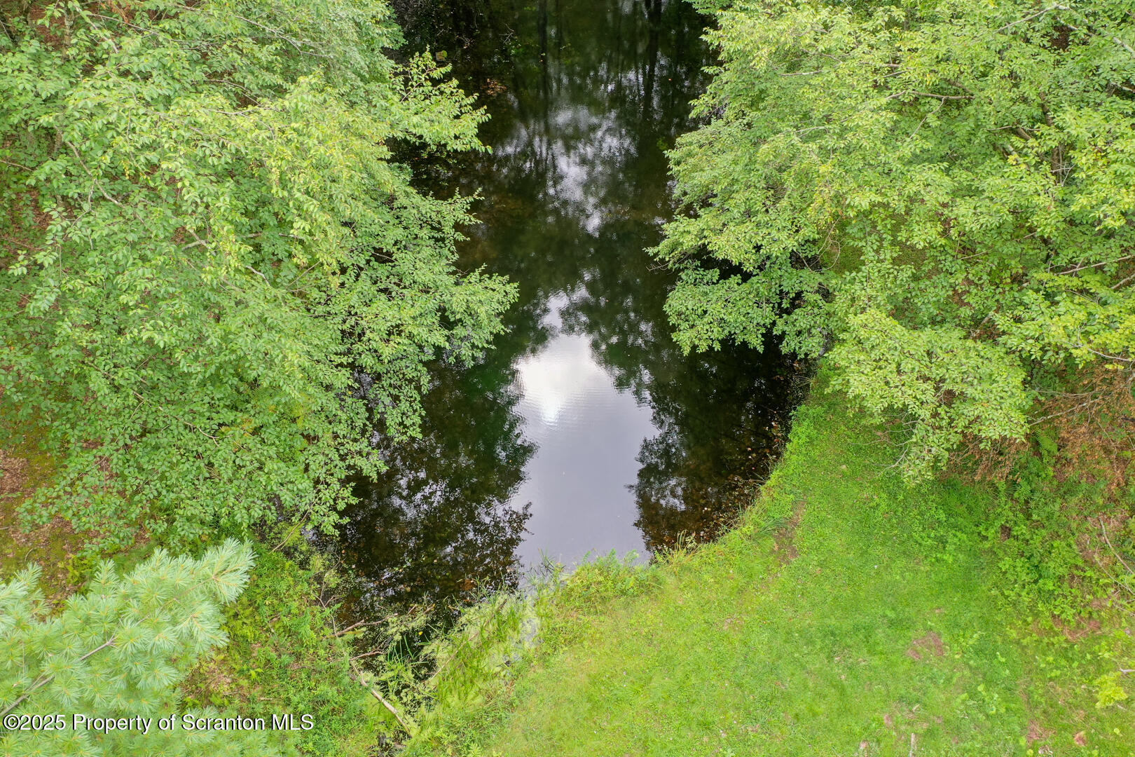 4530 Oak Hill Road Susquehanna, PA 18847 - Photo 4 of 40 a view of a lake view with a garden