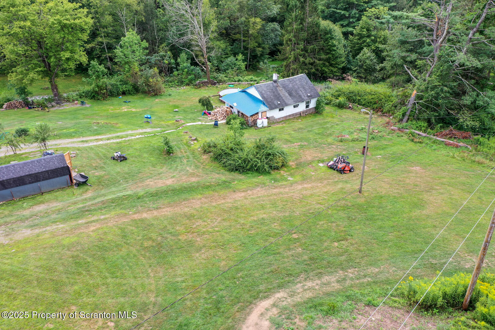 4530 Oak Hill Road Susquehanna, PA 18847 - Photo 6 of 40 a backyard of a house with a yard and trampoline