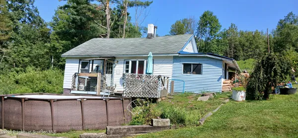 a front view of house with small garden