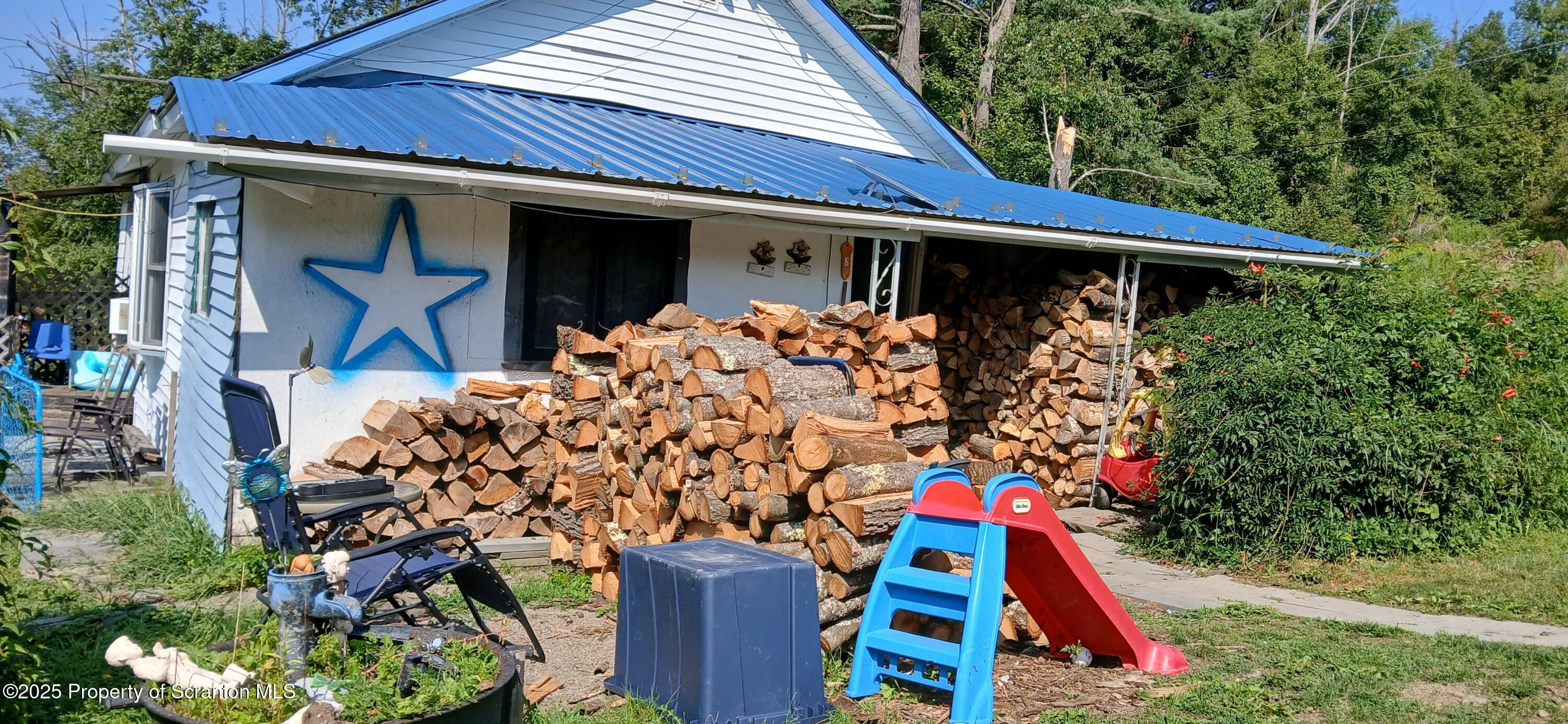 4530 Oak Hill Road Susquehanna, PA 18847 - Photo 8 of 40 a front view of house with small garden