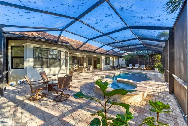 a view of a swimming pool with a patio