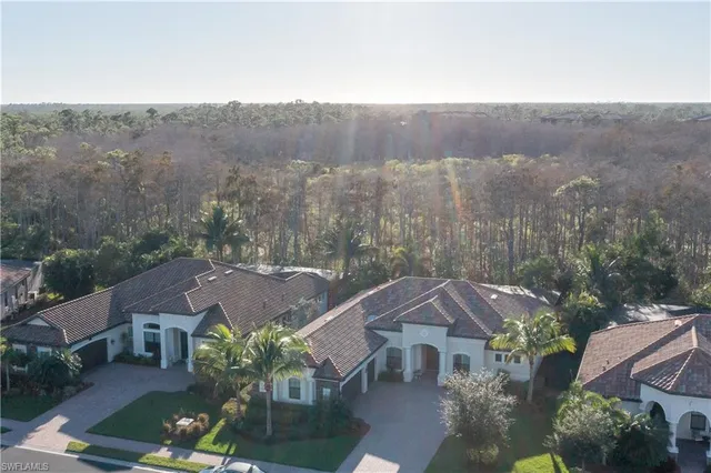 an aerial view of houses with yard