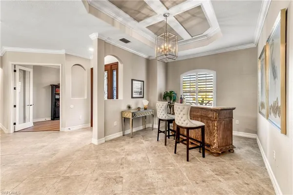 a kitchen with granite countertop a sink cabinets and refrigerator