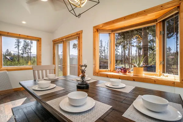 a living room with furniture and a baby crib