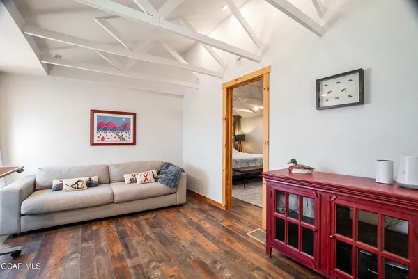 a spacious bedroom with a bed and large windows