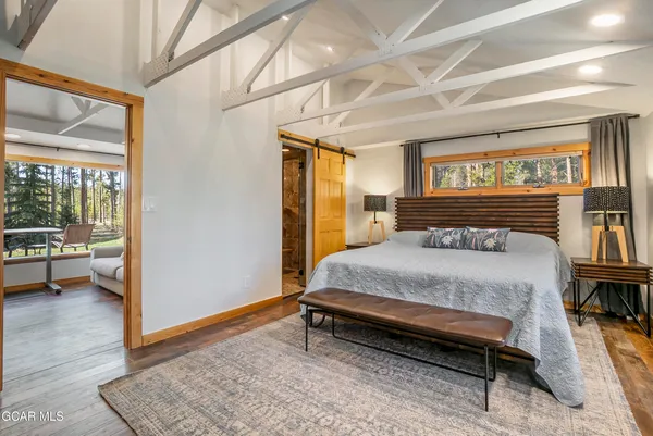 a bathroom with a shower and a glass door