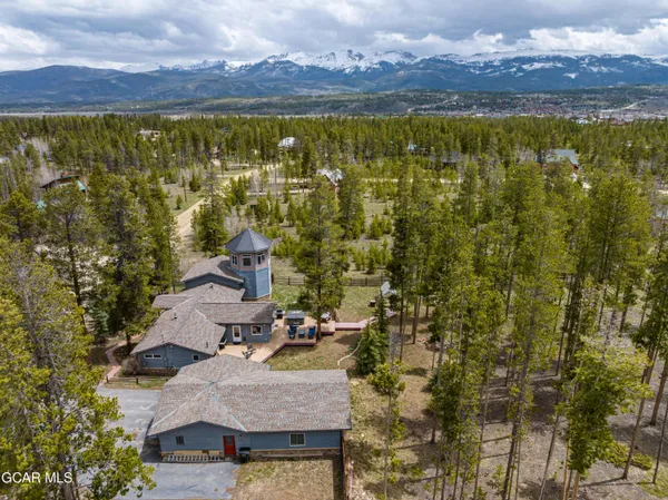 a living room with furniture large window and a fireplace
