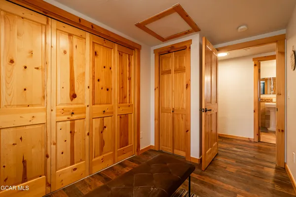 a bedroom with two beds and a wall painting